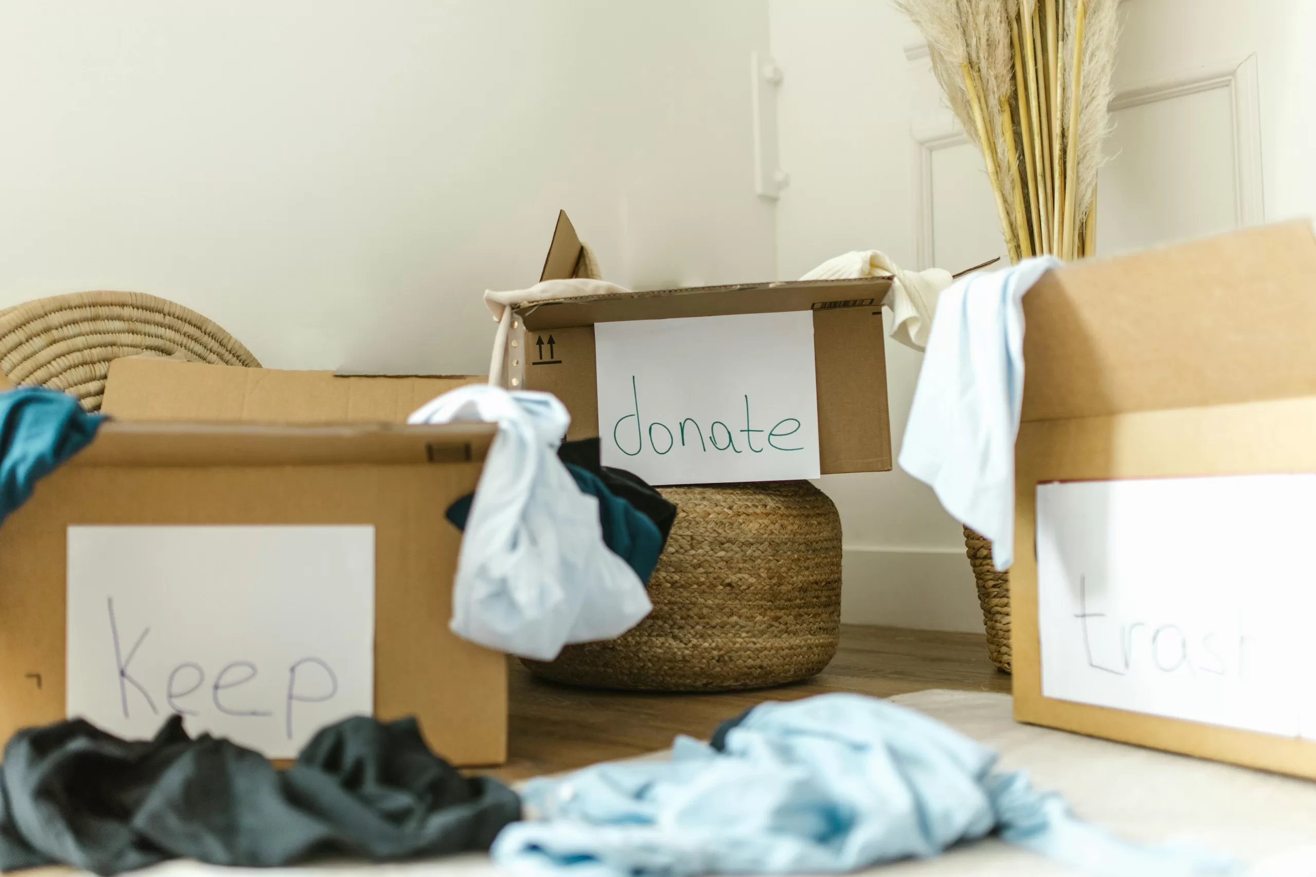 Boxes with things to donate Boxes tagged with things to keep and things to donate in an apartment clear out.